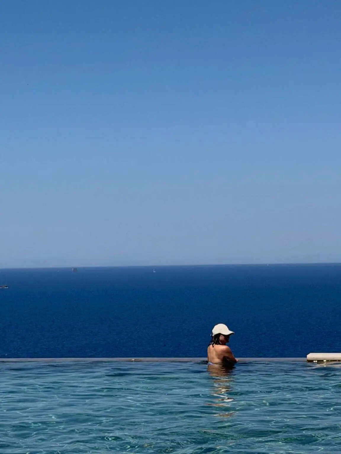 Dressed in a bikini, the actor was seen taking a dip and soaking up the sun while enjoying the scenic getaway.
