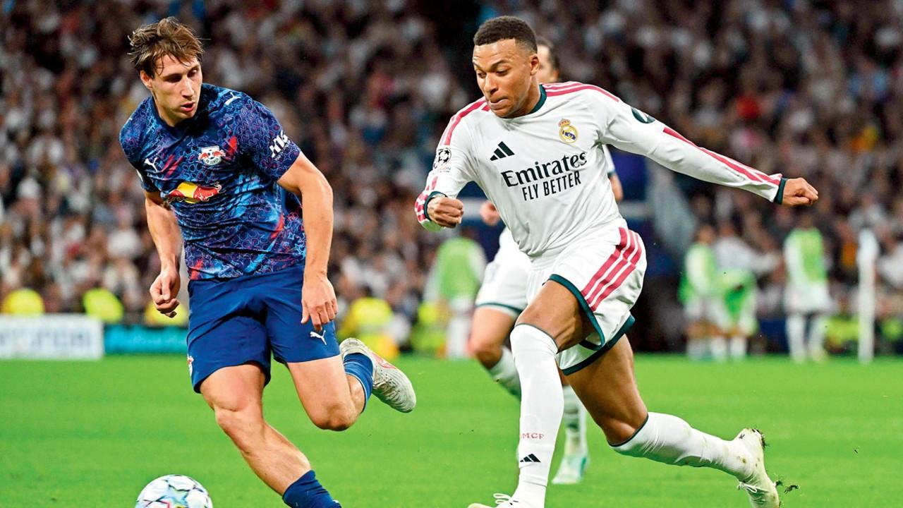 ‘Pressing hard, only way to stop Mbappe’: Barcelona boss Hansi Flick Real Madrid’s Kylian Mbappe (right) during their Champions League match against RB Leipzig recently. Pic/AFP