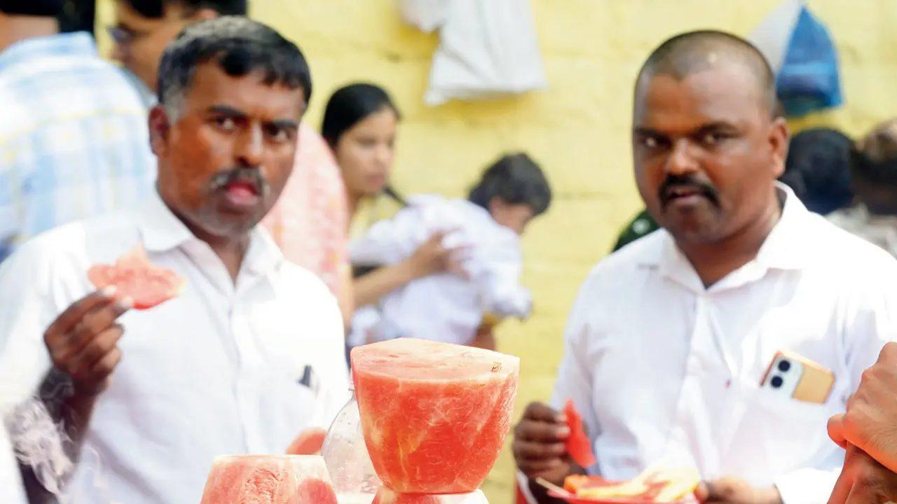 Pedestrians cool off with fresh fruit near the Gateway of India- Mumbai recorded its first post-monsoon heatwave on Friday, with the Santacruz observatory logging a maximum temperature of 37.8 degree Celsius 4.7 degrees above normal. Pedestrians cool off with fresh fruit near the Gateway of India- Mumbai recorded its first post-monsoon heatwave on Friday, with the Santacruz observatory logging a maximum temperature of 37.8 degree Celsius 4.7 degrees above normal.