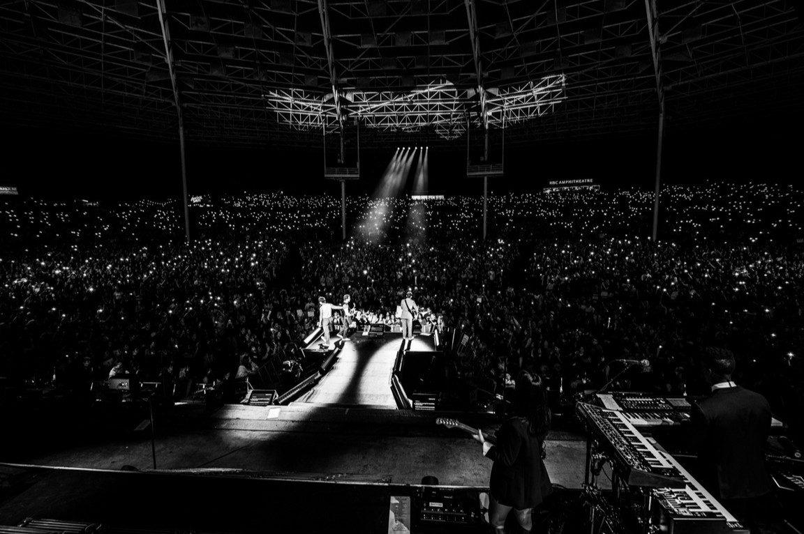 A glimpse of the stage from the Jonas Brothers tour shows the elaborate setup prepared for their performance. The massive stage and lighting added to the concert atmosphere. A glimpse of the stage from the Jonas Brothers tour shows the elaborate setup prepared for their performance. The massive stage and lighting added to the concert atmosphere.