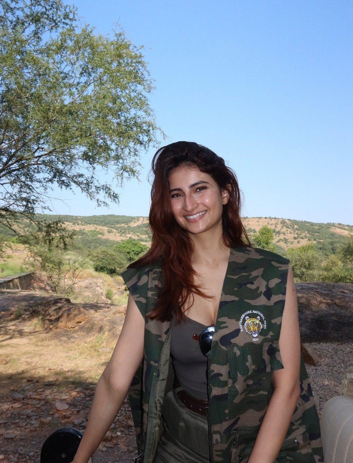 For a day spent outdoors, Palak opts for a casual black tank top paired with a camouflage-print vest. Her laid-back look blends comfort with a hint of rugged style. For a day spent outdoors, Palak opts for a casual black tank top paired with a camouflage-print vest. Her laid-back look blends comfort with a hint of rugged style.