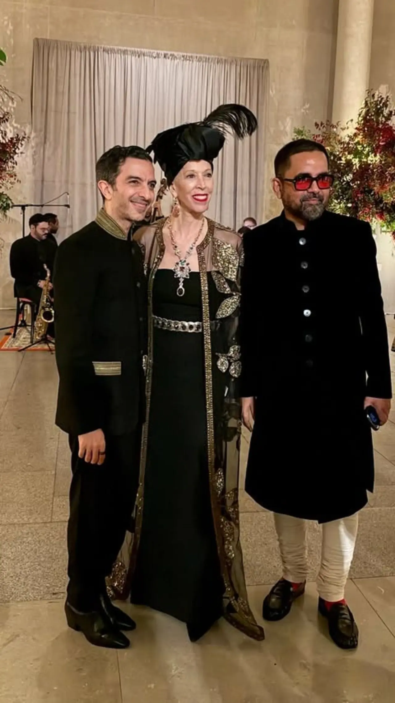 The designer chose a classic black bandhgala and churidar for the evening as he warmly posed with the guests. The designer chose a classic black bandhgala and churidar for the evening as he warmly posed with the guests.