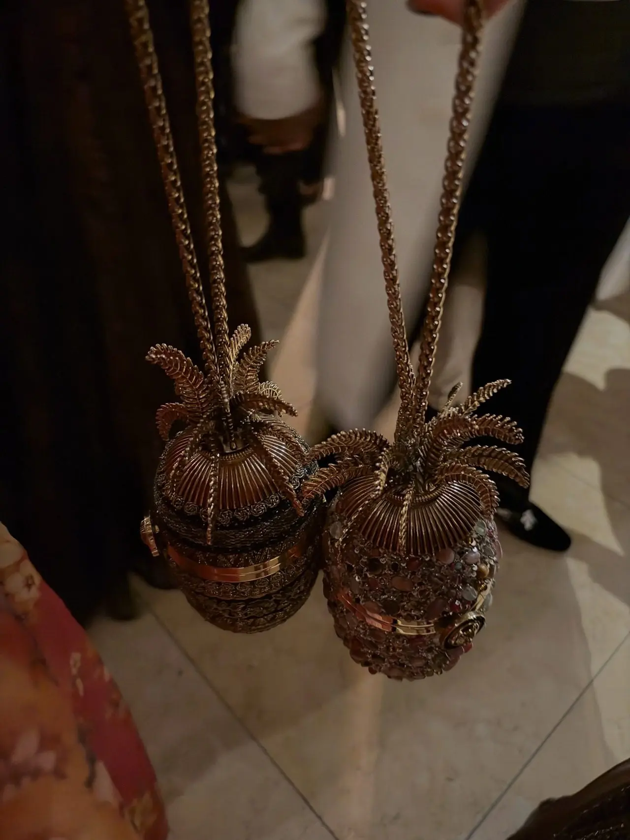 Sabyasachi treated his guests with his signature Pineapple bag, intricately handcrafted with detailed metalwork, stone or crystal inlay, and traditional bead or sequin work. Sabyasachi treated his guests with his signature Pineapple bag, intricately handcrafted with detailed metalwork, stone or crystal inlay, and traditional bead or sequin work.