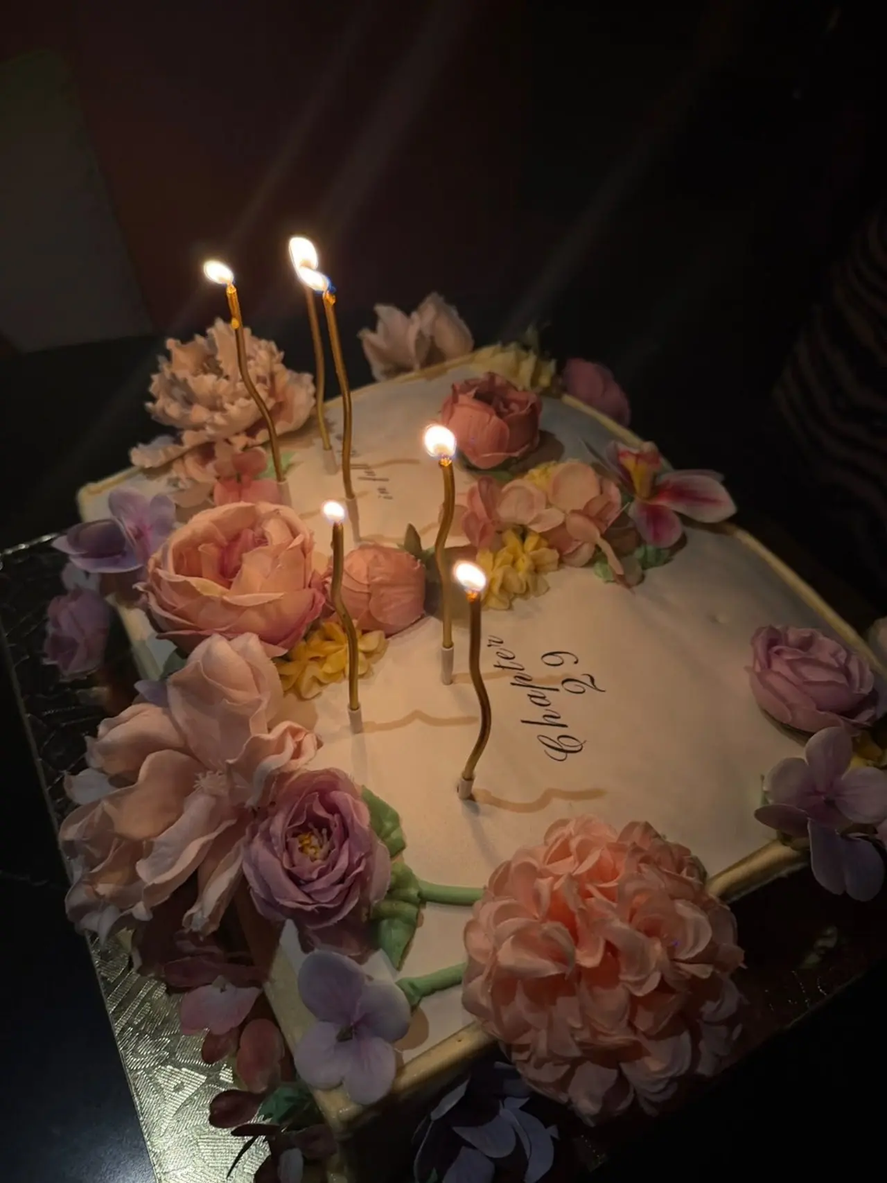 She also shared a glimpse of her Pinterest-worthy birthday cake shaped like a book with floral whipped cream detailing all over. It also had 'Chapter 29' written on it.