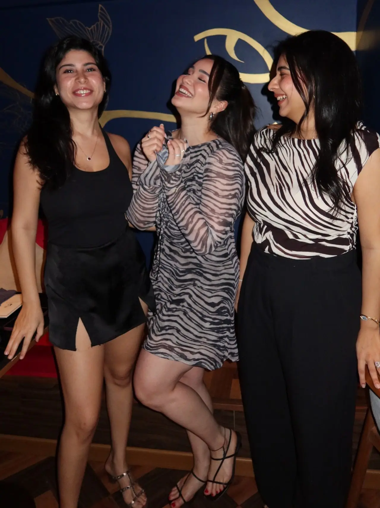 The birthday girl was seen strikin a fake candid pose with her girls during the celebrations.