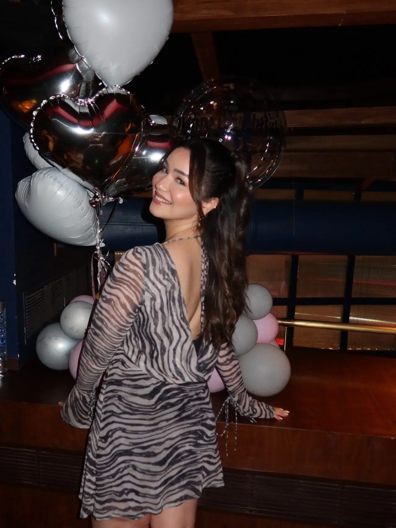 For the occasion, Sara wore a zebra-print mesh mini dress which featured long flared tie sleeves and an open draped back.