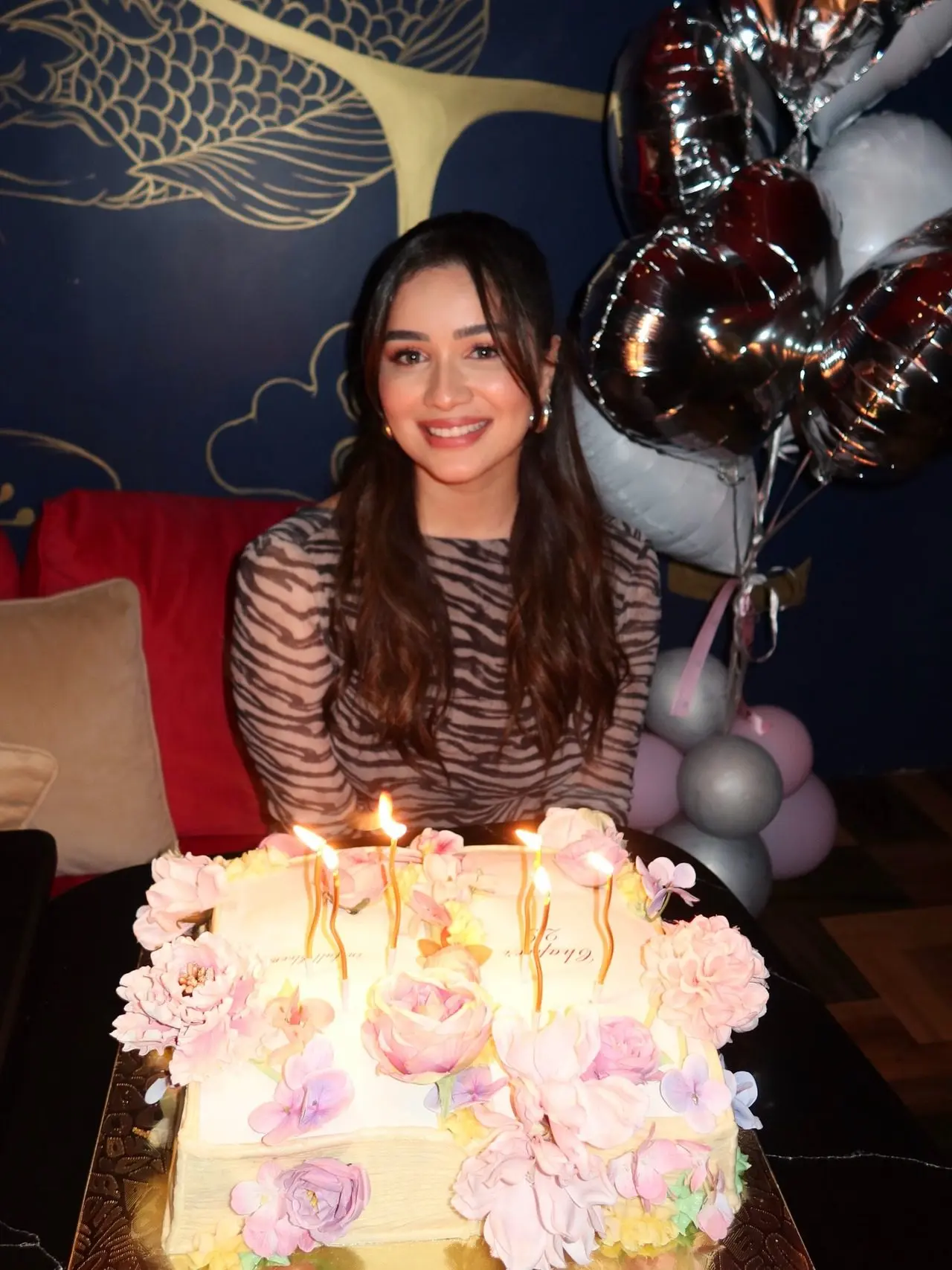 The birthday girl looked excited as she posed with the beautiful cake.