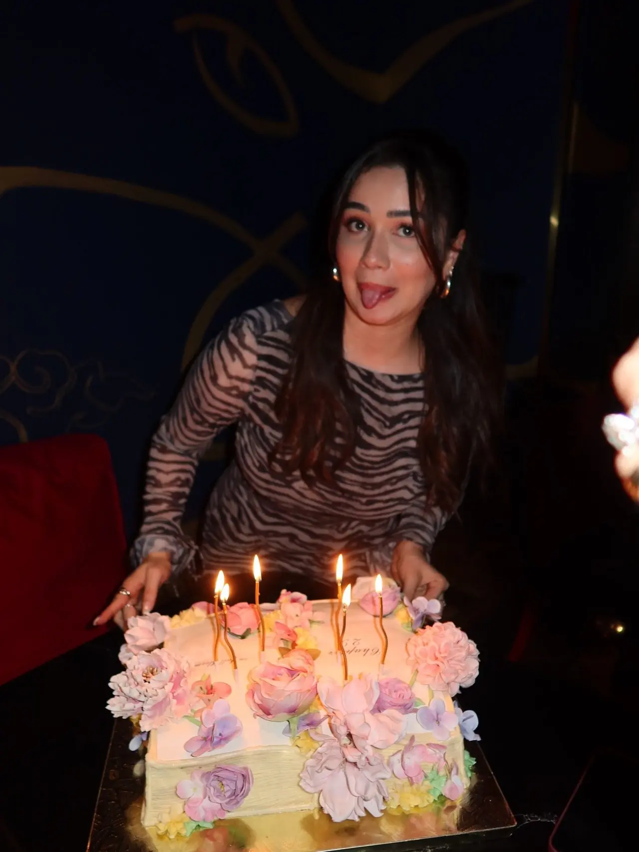 Sara could be seen striking a goofy pose with the cake. "Whoops almost fell on the cake," she wrote in the caption.