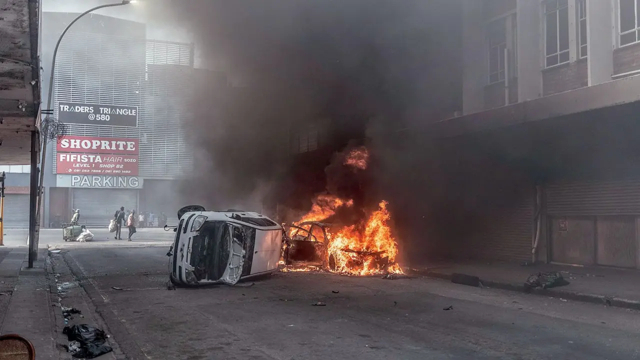 Car set alight during clashes between protesters and foreign nationals in Durban. Pic/AFP
