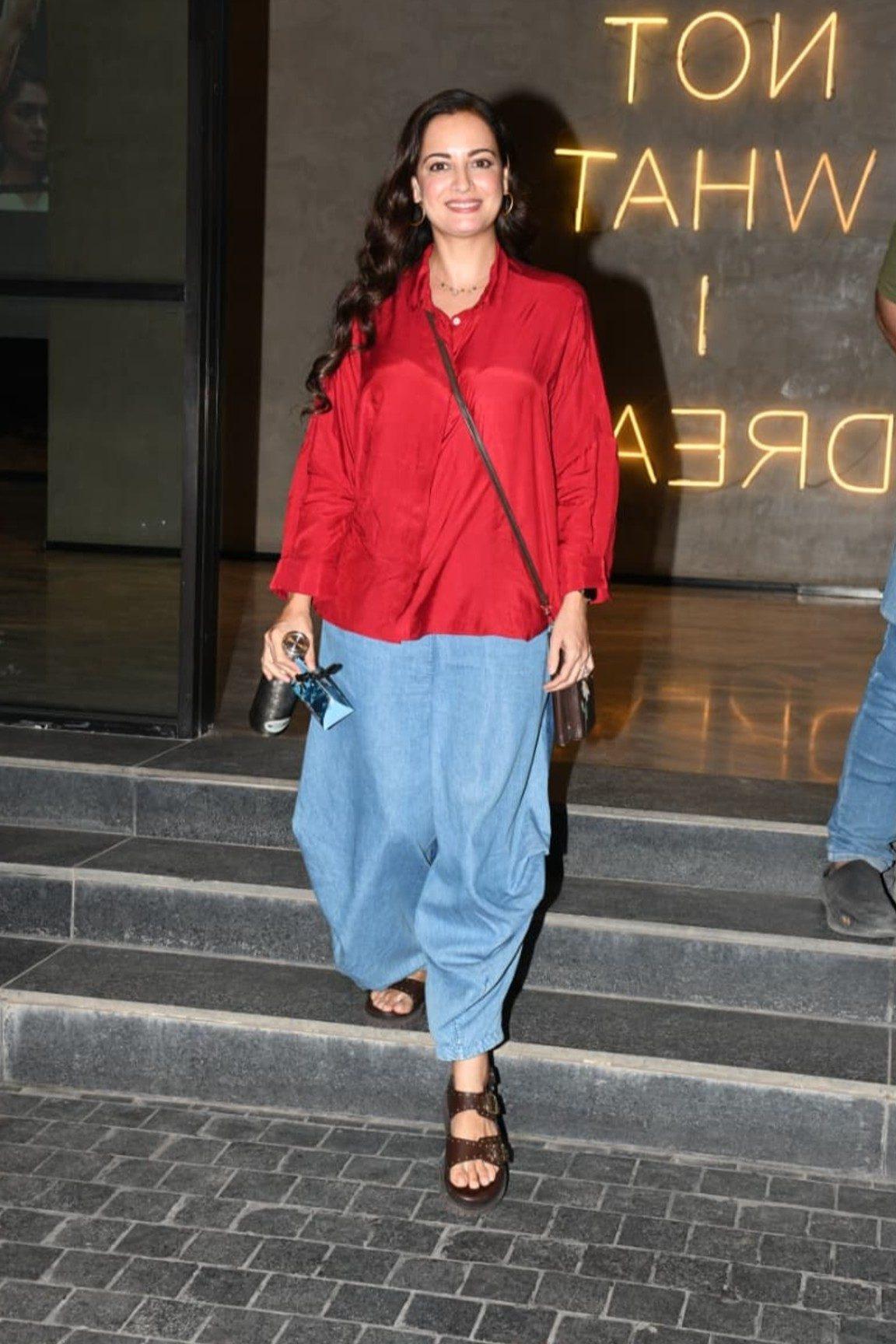 Dia Mirza was recently spotted looking radiant and cheerful in a vibrant red button-down shirt paired with loose, light blue bottoms. Dia Mirza was recently spotted looking radiant and cheerful in a vibrant red button-down shirt paired with loose, light blue bottoms.