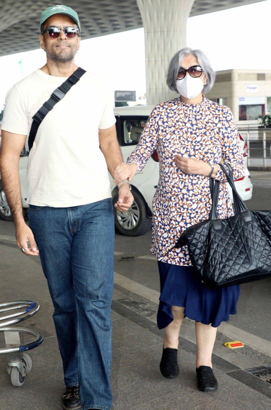 Zeenat Aman was recently spotted arriving at the airport alongside her son, walking hand-in-hand and exuding elegance. Zeenat Aman was recently spotted arriving at the airport alongside her son, walking hand-in-hand and exuding elegance.