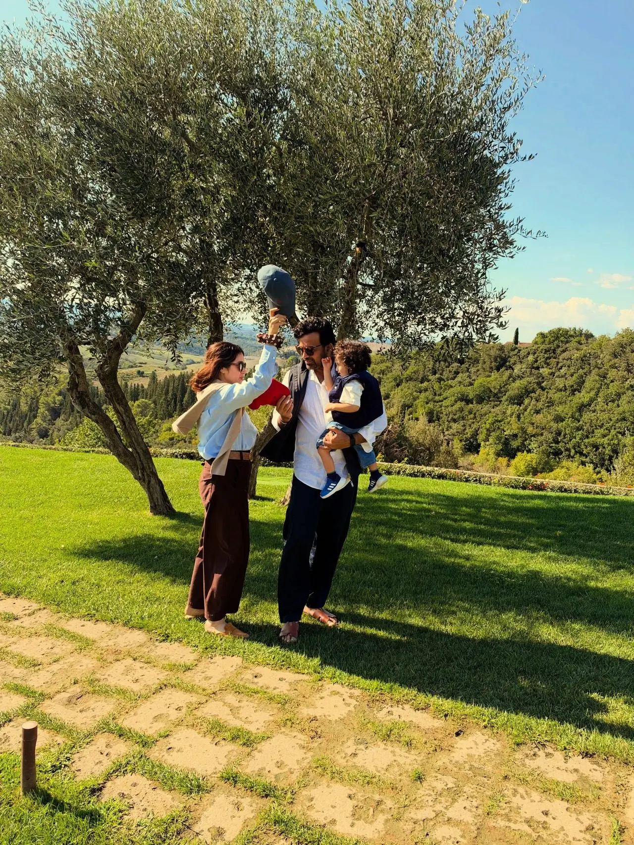 The couple was seen playfully enjoying their time wih their little son on a sunny day. The couple was seen playfully enjoying their time wih their little son on a sunny day.