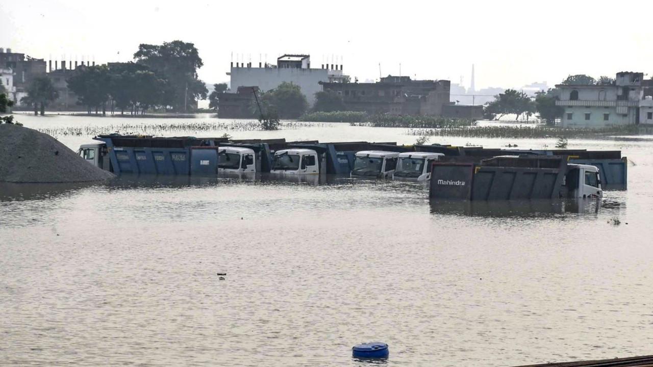 IN PHOTOS | Bihar floods: Rising Ganga inundates villages, roads and farmland Heavy vehicles remain partially submerged in floodwaters following the rise in the water level of the Ganga river, in Patna, Bihar, on Friday. PIC/PTI