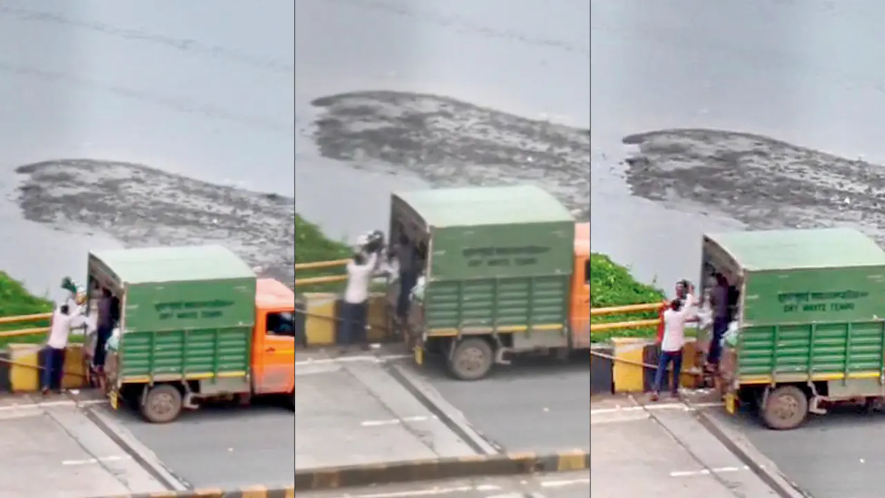 Mid-day Impact: FIR filed over dry waste allegedly dumped into Mogra nalla Screengrabs from the video in which a man allegedly attached to a BMC-appointed agency can be seen throwing a bag of dry waste into the Mogra Nullah in Andheri West’s Lokhandwala area. Pic/By Special Arrangement