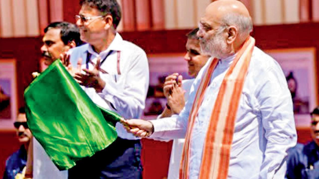Amit Shah flags off India’s first LNG train from Sabarmati station in Gujarat Union Home Minister Amit Shah during the flagging off ceremony from Sabarmati Railway Station, Gujarat. PIC/PTI