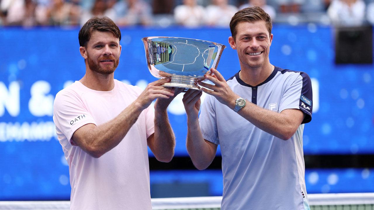 US Open 2026: Harrison-Skupski win men’s doubles title USA's Christian Harrison and Britain's Neal Skupski hold the trophy after defeating Germany's Kevin Krawietz and Tim Puetz during the men's doubles final match on day fourteen of the US Open tennis tournament at the USTA Billie Jean King National Tennis Center in New York City. Pic/AFP
