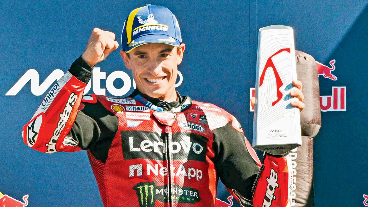 MotoGP: Marc Marquez sizzles in San Marino to win another race Marc Marquez with the winner’s trophy on Sunday. Pic/AFP