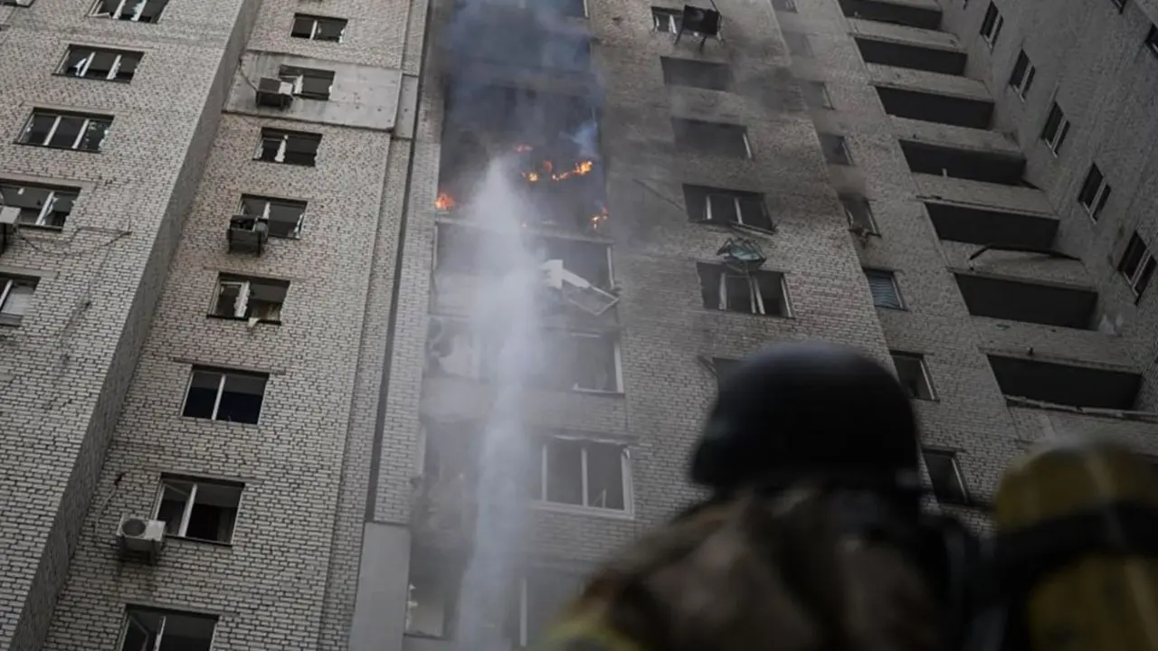 IN PHOTOS | Russia-Ukraine war: Drone hits residential building in Kyiv A Ukrainian rescue personnel member works to extinguish a fire in a residential building following an air attack in Kyiv on Friday. PIC/AFP