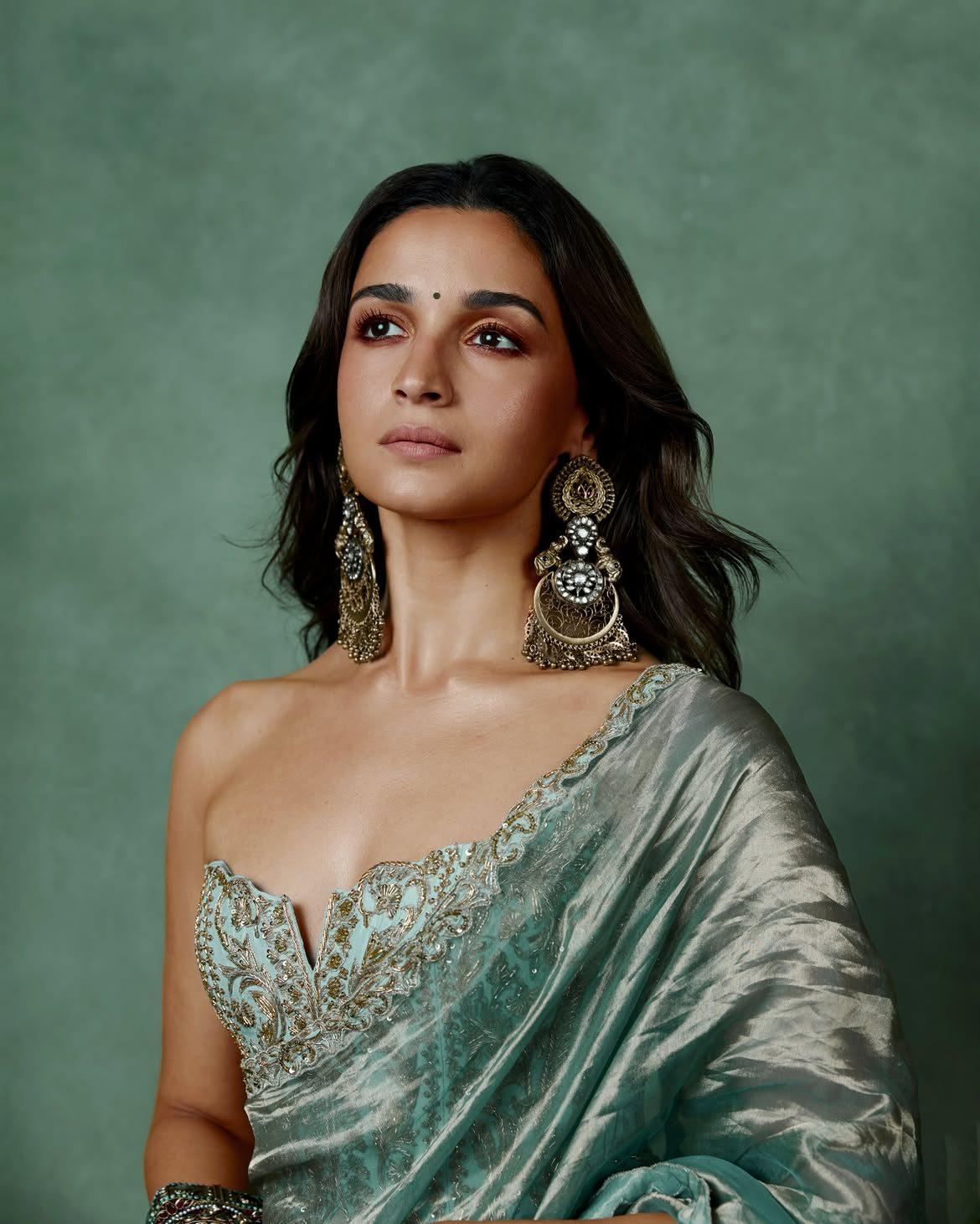 Alia looked elegant in a sea-foam green custom saree from House of Masaba, pairing it with a strapless corset blouse Alia looked elegant in a sea-foam green custom saree from House of Masaba, pairing it with a strapless corset blouse