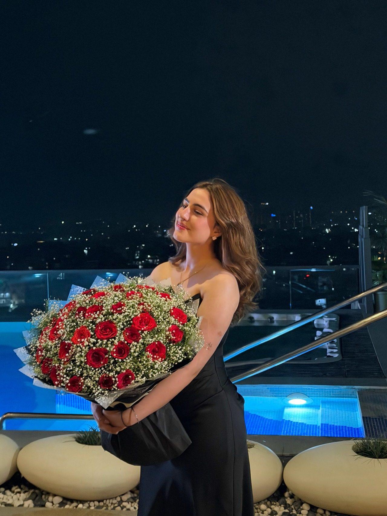 Arshdeep also shared a picture of his girlfriend striking a candid pose in a black dress holding a large bouquet of roses. Arshdeep also shared a picture of his girlfriend striking a candid pose in a black dress holding a large bouquet of roses.