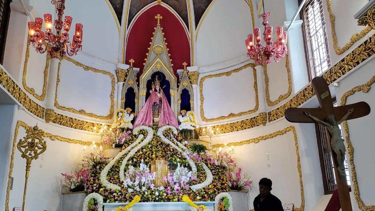 Every year, devotees queue to pray at the church’s altar, which is adorned with colourful flowers. This year is no different, with worshippers pausing after their prayers to admire the beautifully decorated statue Every year, devotees queue to pray at the church’s altar, which is adorned with colourful flowers. This year is no different, with worshippers pausing after their prayers to admire the beautifully decorated statue