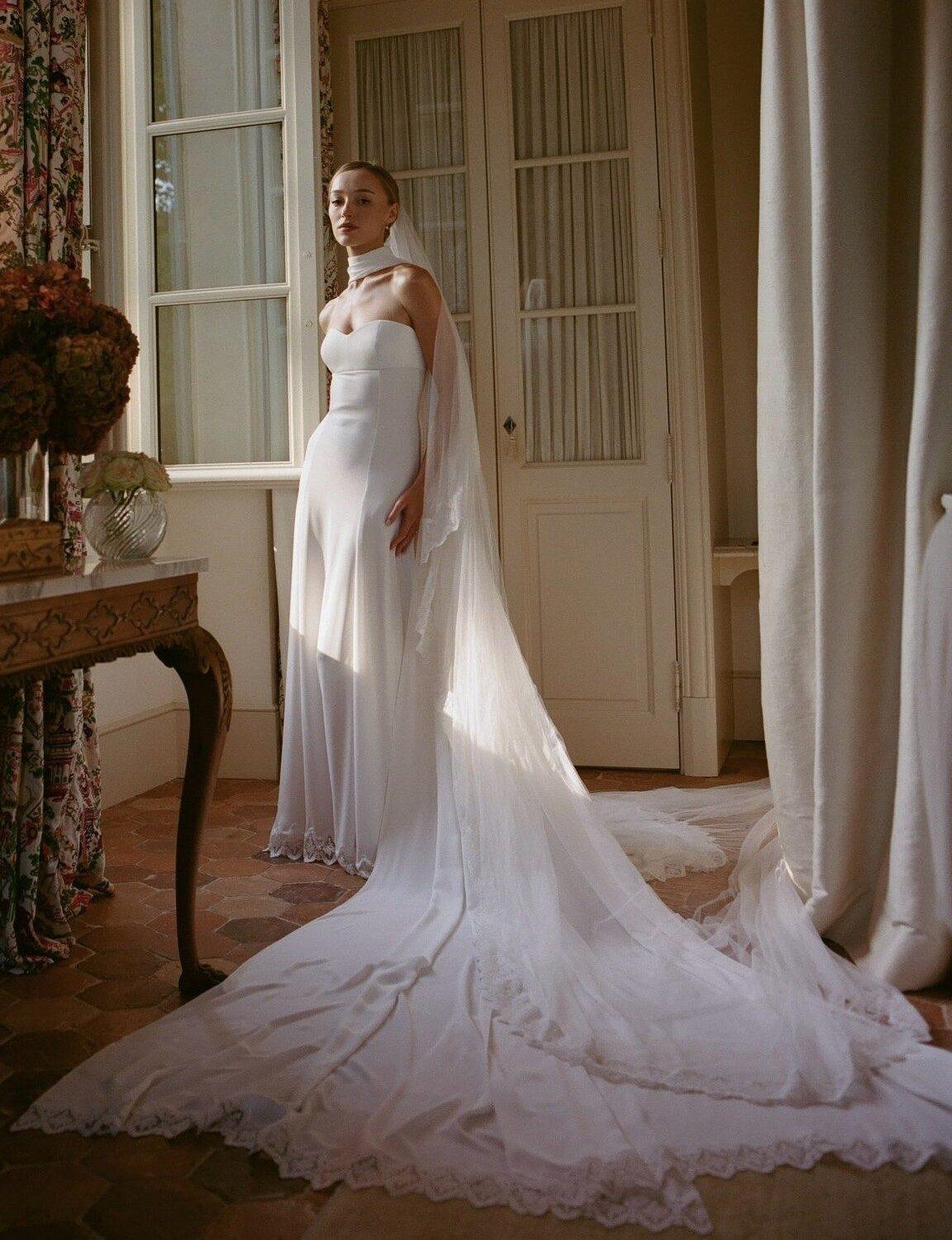 Phoebe Dynevor walked down the aisle at a chateau in Provence, France, wearing a form-fitting, lace-trimmed strapless white gown.