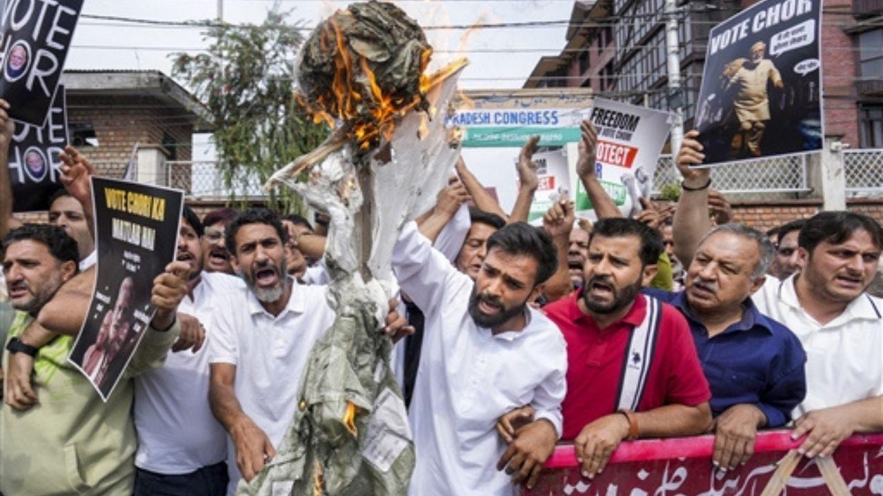 Congress leaders burn an effigy during a protest against Kumar in Srinagar Congress leaders burn an effigy during a protest against Kumar in Srinagar