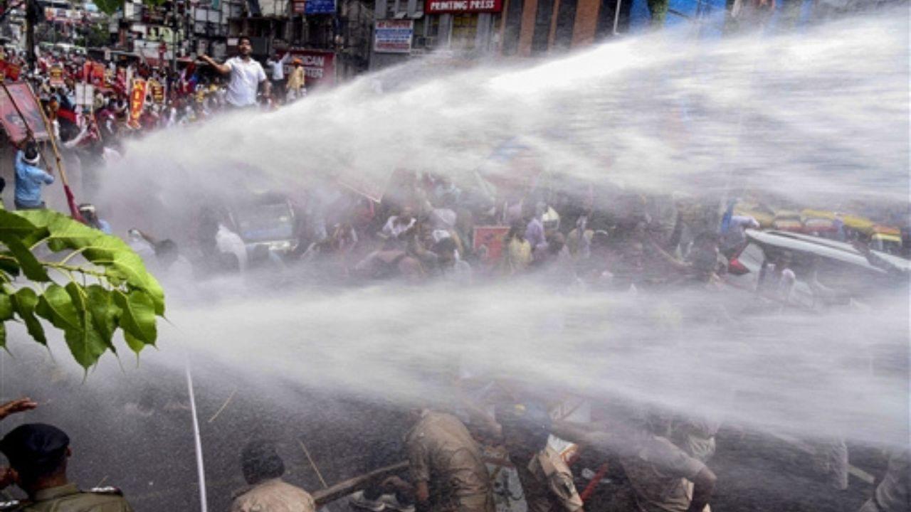 Police personnel use water cannons to disperse Communist Party of India (CPI) workers during the 'Lok Bhavan March' in Patna Police personnel use water cannons to disperse Communist Party of India (CPI) workers during the 'Lok Bhavan March' in Patna