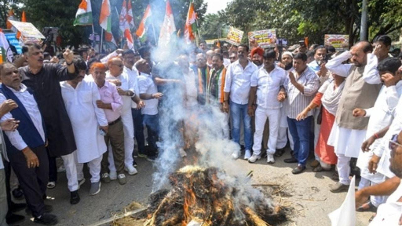 Jharkhand Congress leaders and workers burn an effigy in Ranchi. Jharkhand Congress leaders and workers burn an effigy in Ranchi.