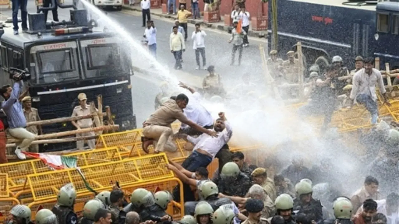 Police use water cannon to disperse Congress workers during a protest against the CEC in Jaipur Police use water cannon to disperse Congress workers during a protest against the CEC in Jaipur