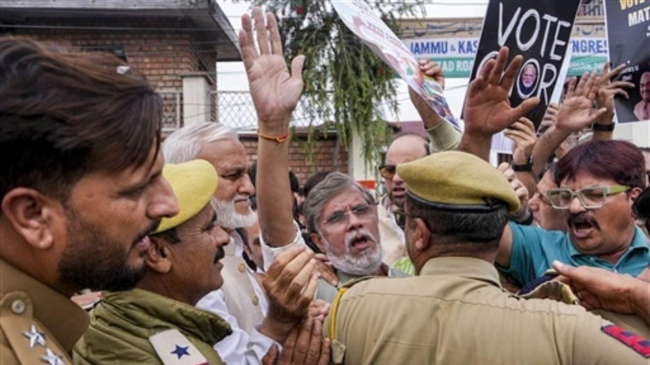 Congress leader Pawan Khera being stopped by police officials during a protest against Chief Election Commissioner Gyanesh Kumar in Srinagar Congress leader Pawan Khera being stopped by police officials during a protest against Chief Election Commissioner Gyanesh Kumar in Srinagar