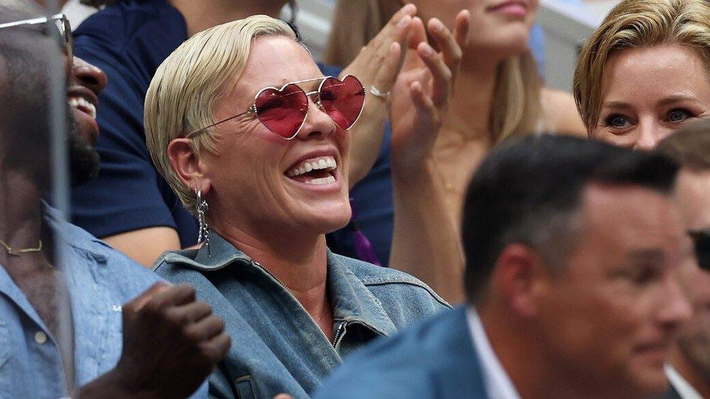 American singer-songwriter Pink sits alongside actress Elizabeth Banks and actress Amy Adams while enjoying the women's singles final at the US Open in New York.
