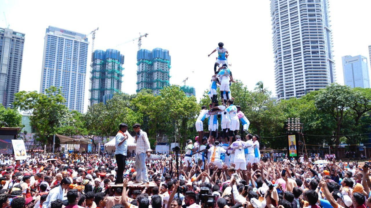 Govindas climb multi-tiered human pyramids to break the Dahi Handi during the celebrations
