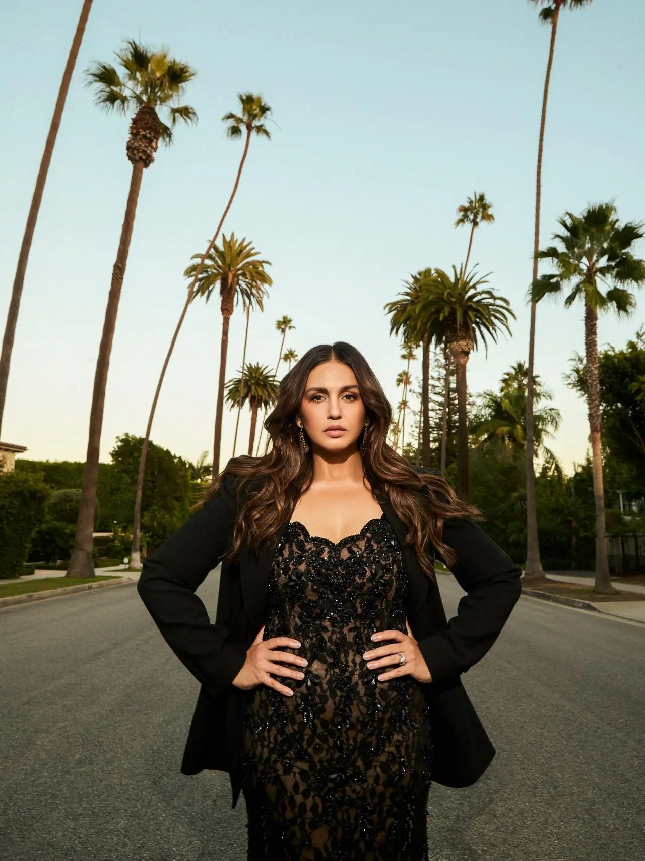 Huma paired the lacy dress with a a tailored Gabriela Hearst jacket, bringing power and balance to the outfit. Huma paired the lacy dress with a a tailored Gabriela Hearst jacket, bringing power and balance to the outfit.