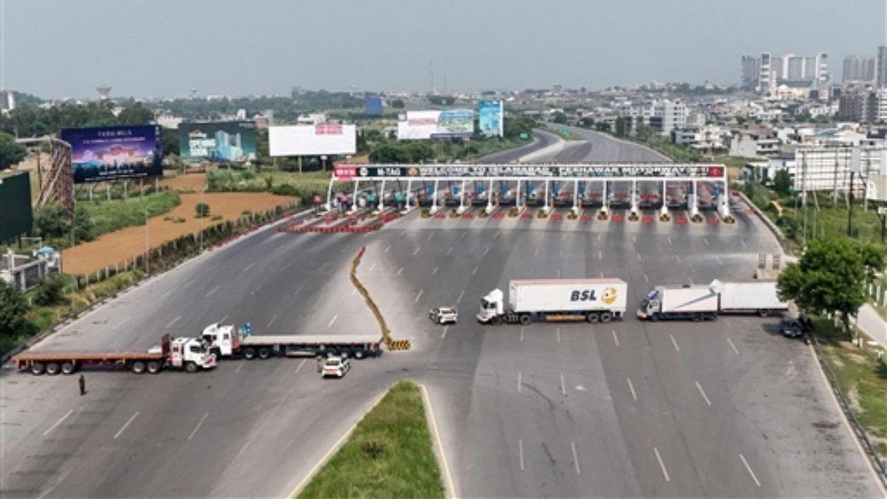 An aerial view shows the Islamabad-Peshawar Motorway blocked with trucks placed by authorities in Islamabad. Pic/AFP