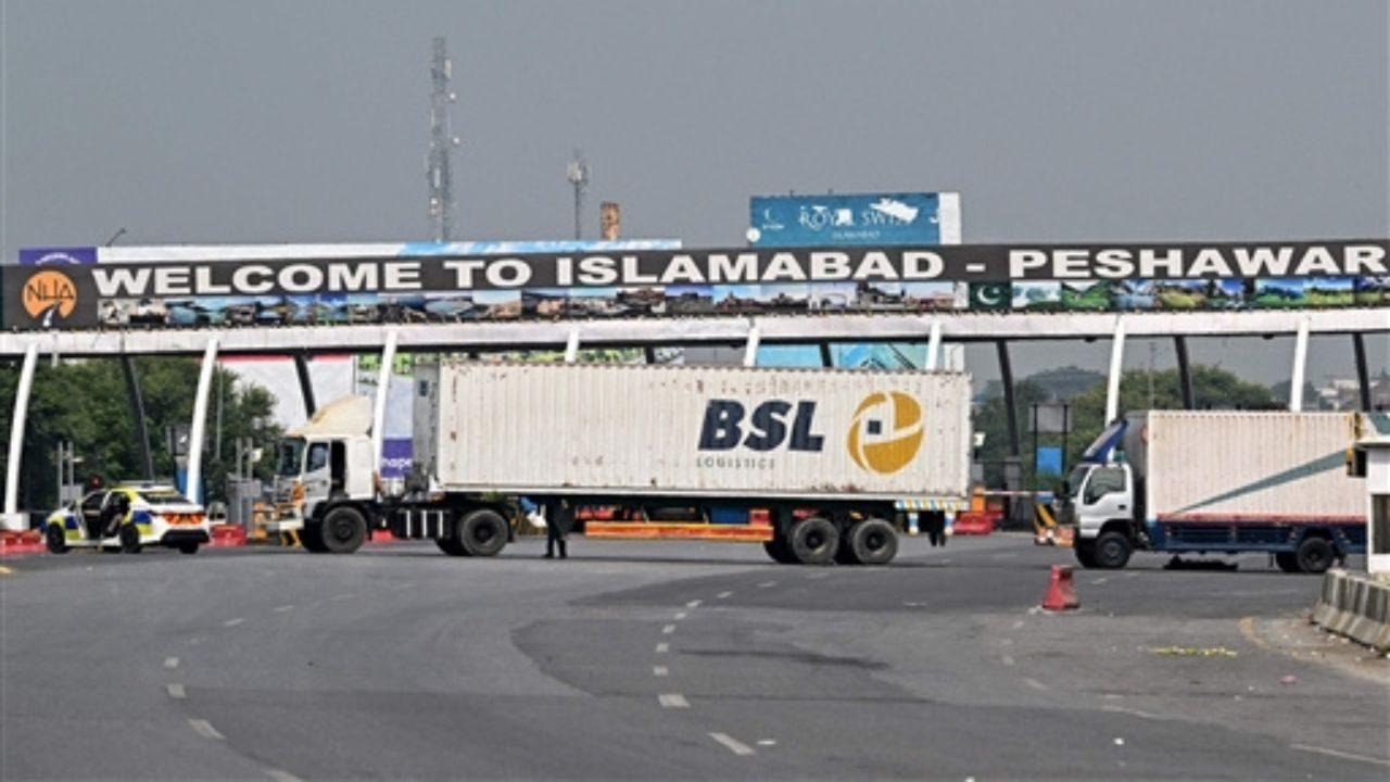 Trucks Deployed to Block Islamabad–Peshawar Motorway. Pic/AFP