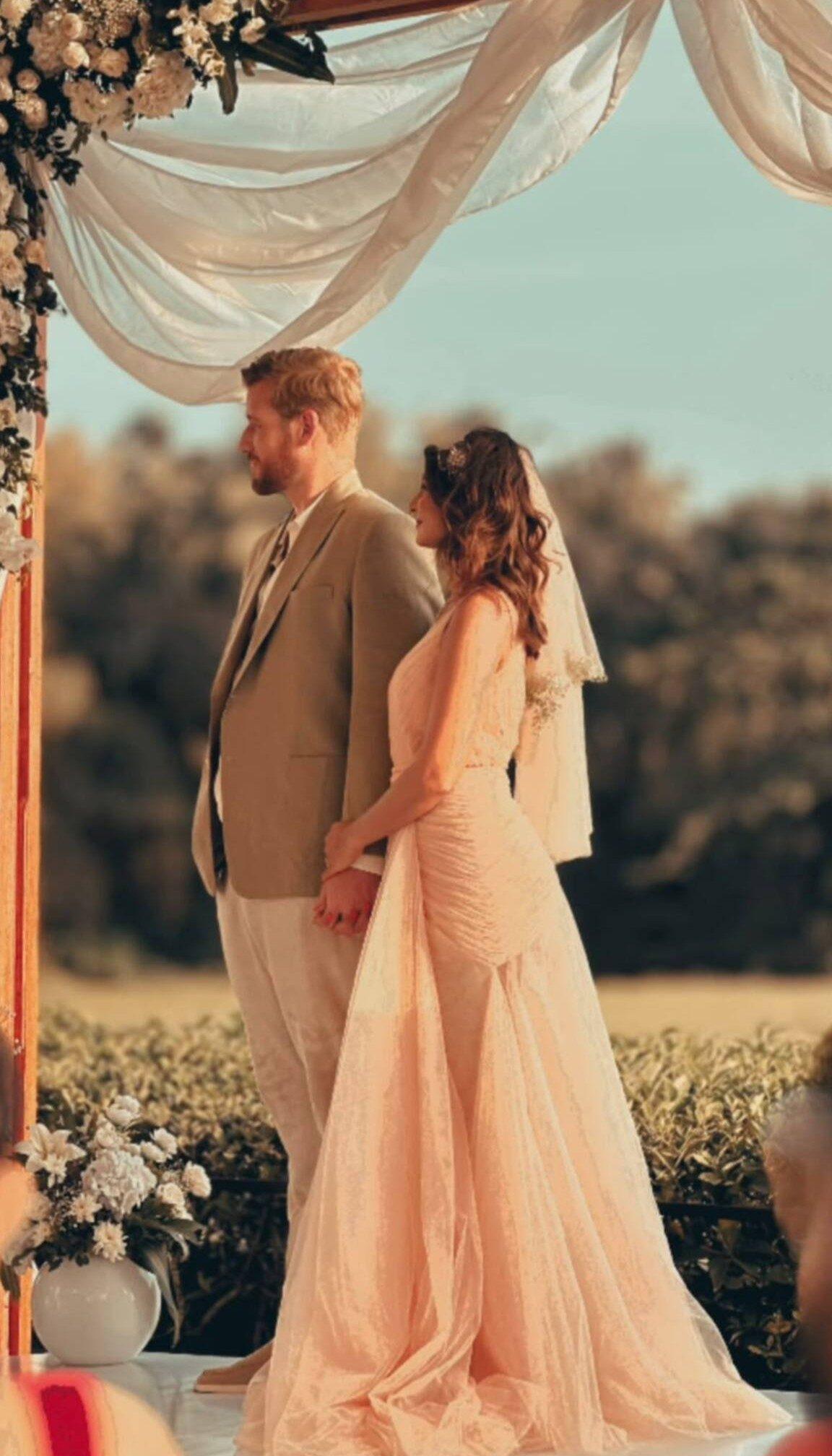 Jennifer Winget looks ethereal alongside William for their Christian-style wedding ceremony. She wears a soft pastel blush-toned gown with sheer veil.