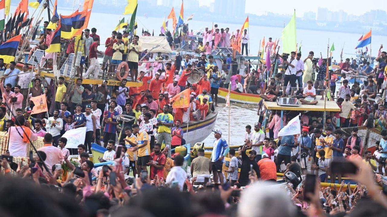 The massive idol, covered in pink gulal, was carried through packed streets on a grand platform, with devotees dancing and joining the procession The massive idol, covered in pink gulal, was carried through packed streets on a grand platform, with devotees dancing and joining the procession