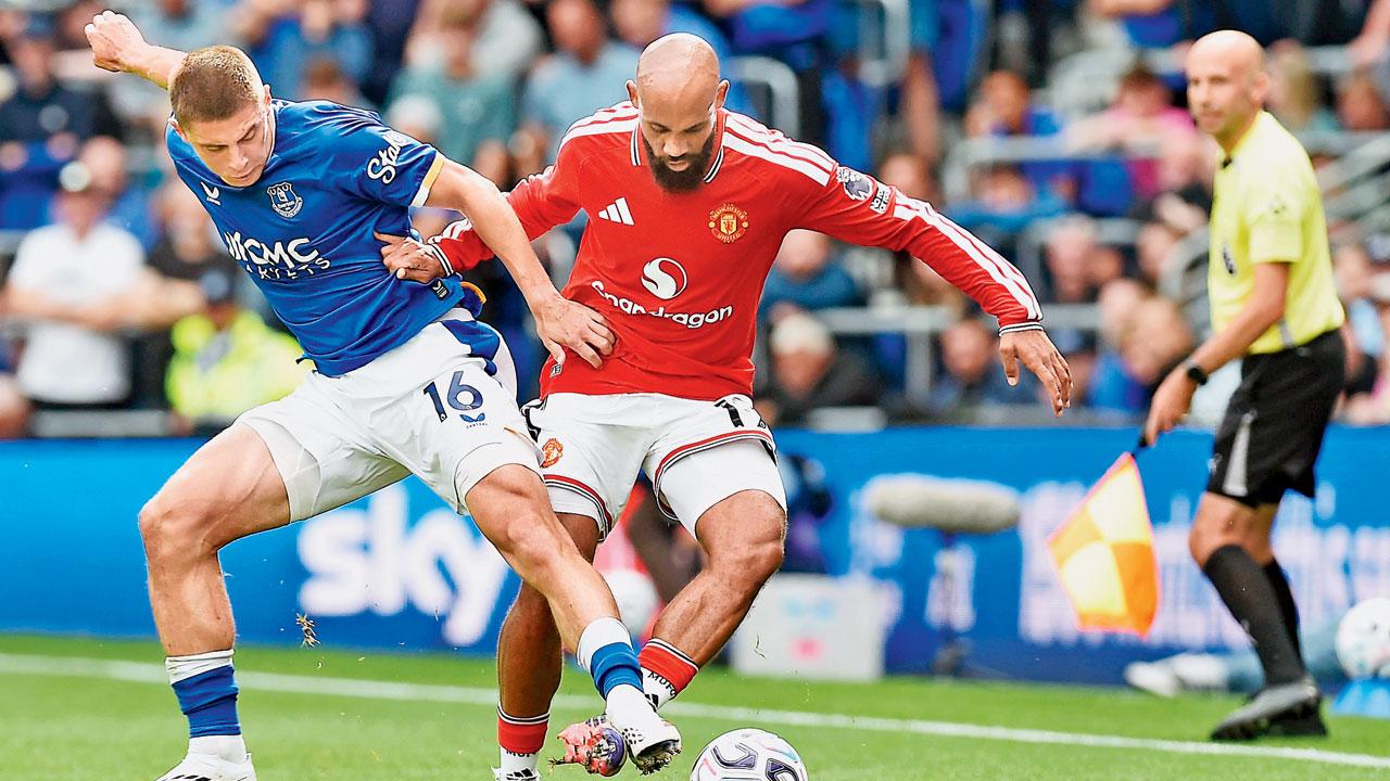 Premier League: Everton hold Man Utd to nail-biting 2-2 draw Everton’s Vitaliy Mykolenko (left) is tackled by Man Utd’s Bryan Mbeumo in Liverpool on Sunday. Pic/AFP