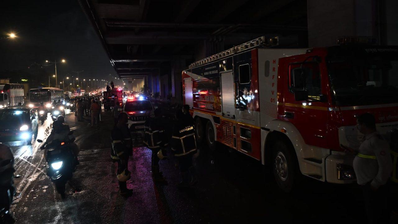 A senior Mumbai Police official said, a bus, Mahadeo Traveler MJ 01AN 1695 going towards Gujarat caught fire under the metro station A senior Mumbai Police official said, a bus, Mahadeo Traveler MJ 01AN 1695 going towards Gujarat caught fire under the metro station
