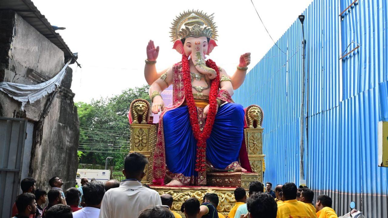 The 22-foot-high Ganesha idol, made from paper, is carried through Mumbai on Aug 6 The 22-foot-high Ganesha idol, made from paper, is carried through Mumbai on Aug 6