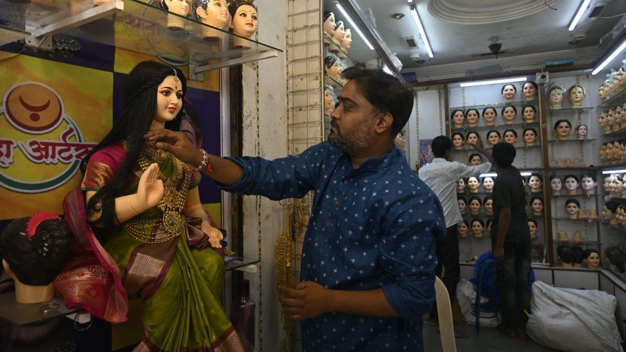 The market is well known for its wide collection of Gauri masks, or mukhavate, including both standard and standing varieties
