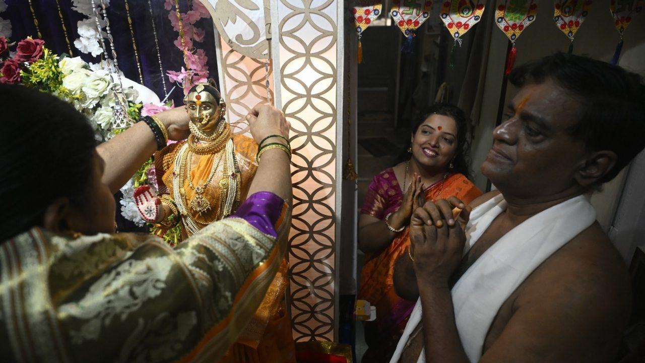Devotees begin by preparing a special Gauri altar at home, adorning it with flowers, lights and traditional artefacts