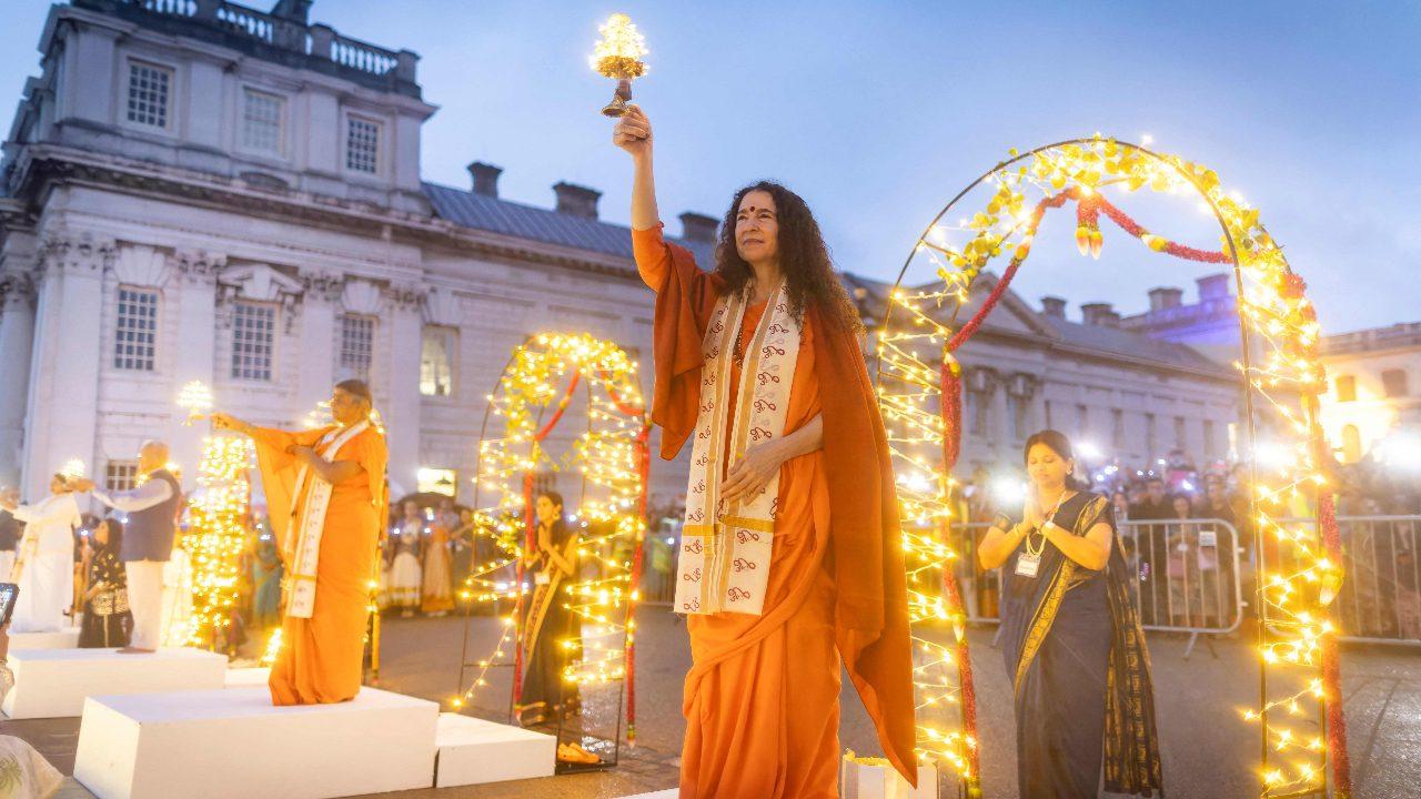 Dancers arrive to take part in the ceremony as they joined several other devotees to observe the traditional Indian ritual in London