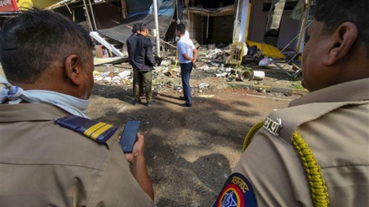 Police and administrative officials inspect the site after a commercial gas cylinder blast at an eatery damaged six shops and injured two workers in Sanpada, Navi Mumbai, on Tuesday