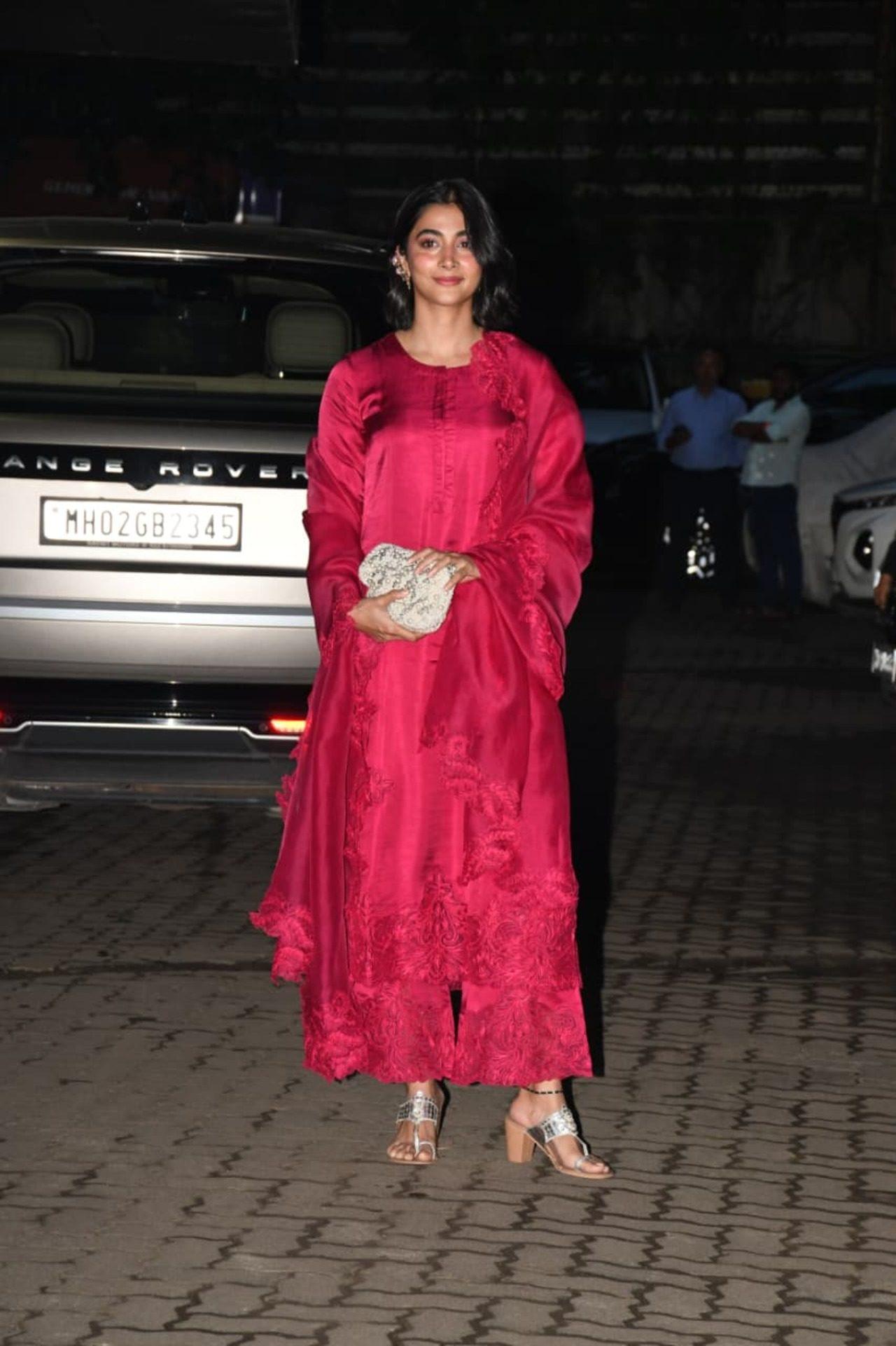 Pooja Hegde was also seen arriving dressed in an all-red ethnic suit at Sohail Khan's home for Ganpati celebrations. Pooja Hegde was also seen arriving dressed in an all-red ethnic suit at Sohail Khan's home for Ganpati celebrations.