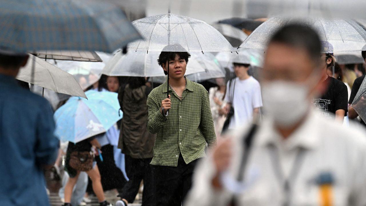 People were seen wading through flooded roads in Funabashi and Ichikawa cities in Chiba Prefecture, while pedestrians in Tokyo's Shibuya district used umbrellas as torrential rain affected the capital and surrounding areas (Pic/AFP) People were seen wading through flooded roads in Funabashi and Ichikawa cities in Chiba Prefecture, while pedestrians in Tokyo's Shibuya district used umbrellas as torrential rain affected the capital and surrounding areas (Pic/AFP)