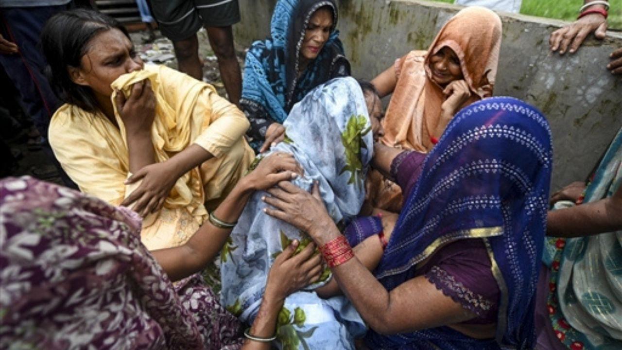 Family members mourn after a massive explosion at a firecracker factory Family members mourn after a massive explosion at a firecracker factory