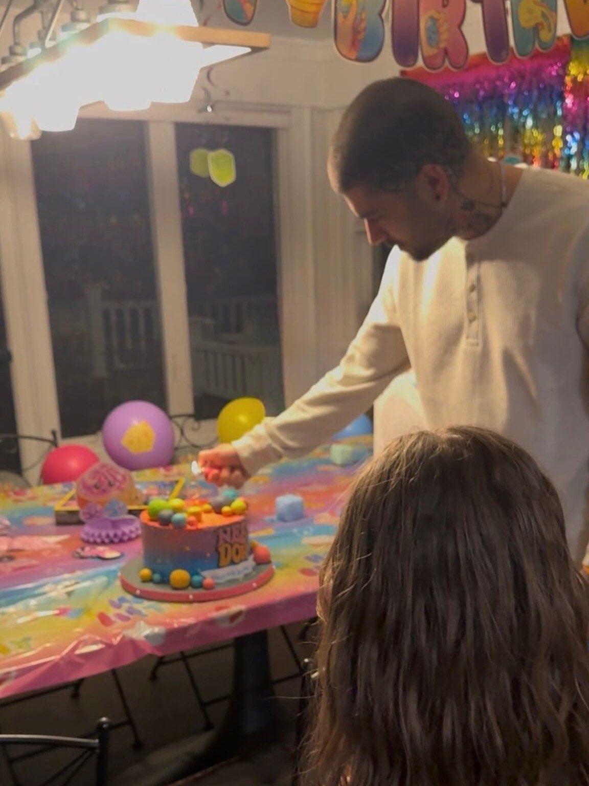 Zayn kicked off his carousel with an adorable picture of himself lighting the candles before Khai cut her birthday cake. Zayn kicked off his carousel with an adorable picture of himself lighting the candles before Khai cut her birthday cake.