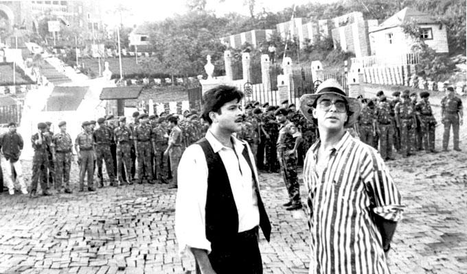 Anil Kapoor credits his life and career to veteran actor Anupam Kher for giving him constant support. In picture: Anil Kapoor with Vidhu Vinod Chopra on the sets of '1942: A Love Story'